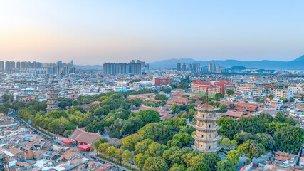 Fototapeta na wymiar Aerial photography of the East and West Twin Towers of Kaiyuan Temple and West Street of Quanzhou City, Quanzhou City, Fujian Province, China