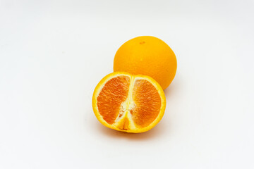 Orange with cut in half isolated on white background.