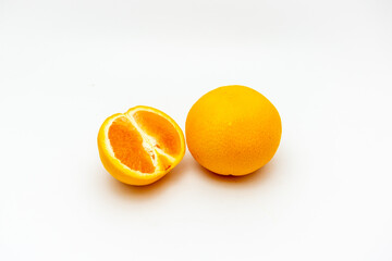 Orange with cut in half isolated on white background.