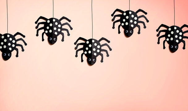 Halloween paper craft black spiders - flat lay