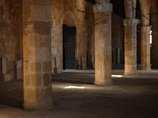 Rhodes, Greece - April 21, 2023: Ancient ruins in the Archeological Museum of Rhodes Town. beautiful old columns in the museum and sun light