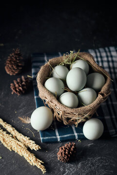 salted eggs, duck eggs in the bamboo basket and sackcloth with dark background