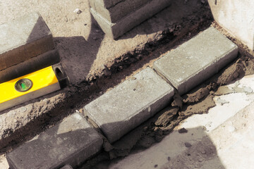 View of sidewalk brickwork. Paving bricks in cement. Background.