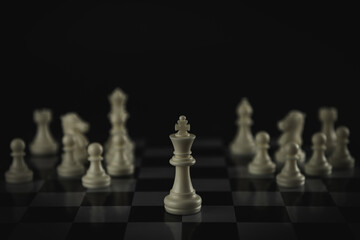 Pieces on chess board on black background for playing game and strategy.