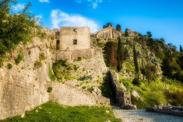 The Ruins of the St John Fortress and Castle in the Hillside Raising above Kotor, Montenegro - obrazy, fototapety, plakaty