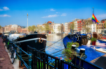 Boats Moored by the River Amstel in in Amsterdam, Holland