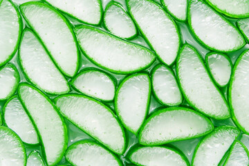 Fresh aloe vera slice soak in aloe vera gel texture for background , top view , flat lay.