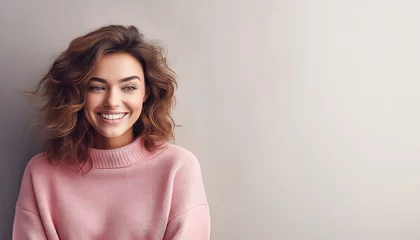 Tuinposter Gentle young woman in pink sweater feels warm and satisfied © terra.incognita