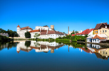 The Vajgar Pond in the Hamersky Potok River at Jindrichuv Hradec in the Czech Republic, with the Famous Castle - obrazy, fototapety, plakaty
