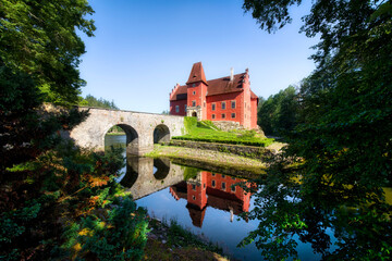 Fototapeta na wymiar The Small, Charming Cervena Lhota Castle in a Lake in South Bohemia in the Czech Republic