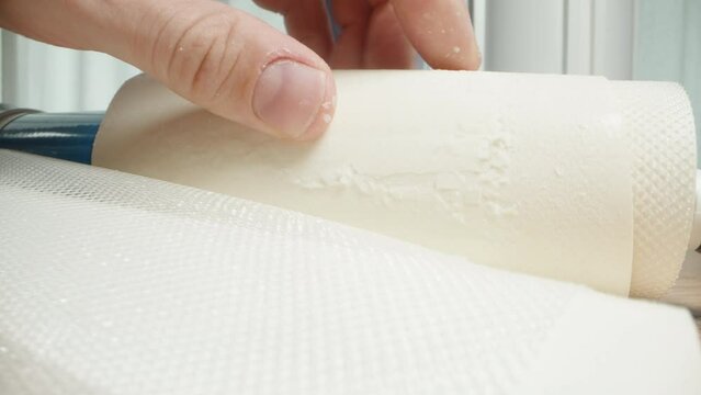 Used water filter, reverse osmosis membrane, its layers are covered with scale, close-up. Water contamination.