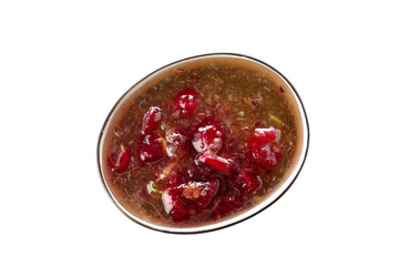 Bowl with tasty gooseberry jam on white background