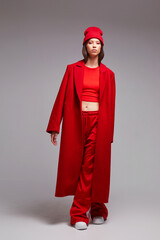 Fashion asian female model in red coat. - 651440533