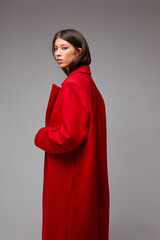 Fashion asian female model in red coat. - 651440563