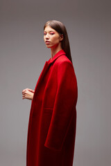Fashion asian female model in red coat.
