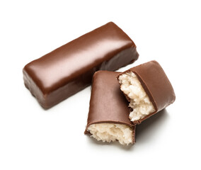 Tasty chocolate covered coconut candies on white background