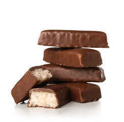 Tasty chocolate covered coconut candies on white background