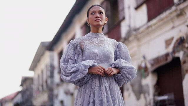 Woman Stands Amidst Vigan's Heritage Architecture