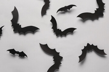 Fototapeta premium Paper bats for Halloween party on grey background