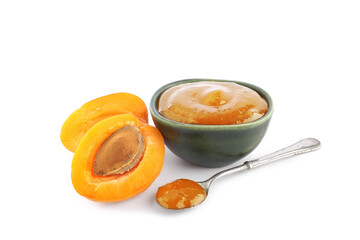Bowl and spoon with sweet apricot jam on white background