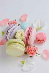 Top view Set Beautiful colorful French macaroons and flowers. Spring Flat lay white background