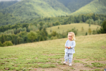 small girl walking in Carpathian mountains, Ukraine