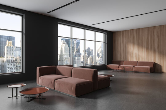 Modern office chill room interior with couch in row near panoramic window