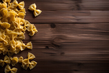 Raw farfalle pasta on dark wooden background.