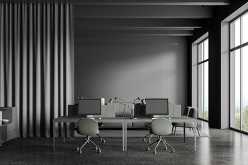 Grey workplace interior with pc desktop and furniture, panoramic window