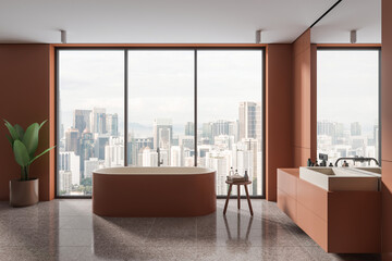 Orange bathroom interior with tub and sink