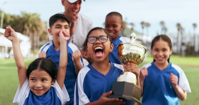 Football celebration, sports team trophy and children excited, happy or celebrate winning, competition victory or success. Soccer player prize, teamwork achievement and kids smile for game victory