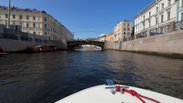 Overview of the sights of St. Petersburg, view from the Neva River. Shot on iPhone 14 pro max . Walking along the Neva River in St. Petersburg by boat POV view