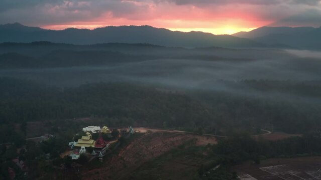 Buddhist temple and Su Tong Pae Bridge during sunrise. Mae Hong Son in Thailand