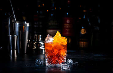 Espresso Negroni cocktail drink with dry gin, red vermouth and bitter, espresso, coffee liqueur,...