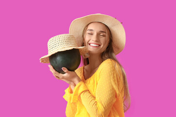 Young woman with fresh watermelon in summer hats on purple background