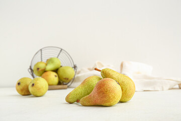 Ripe pears on white background