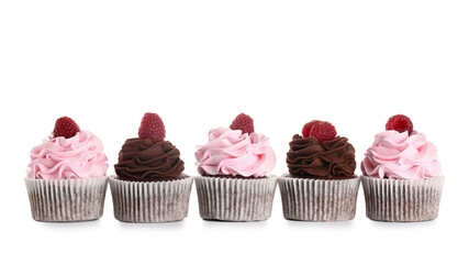 Tasty cupcakes with raspberries on white background