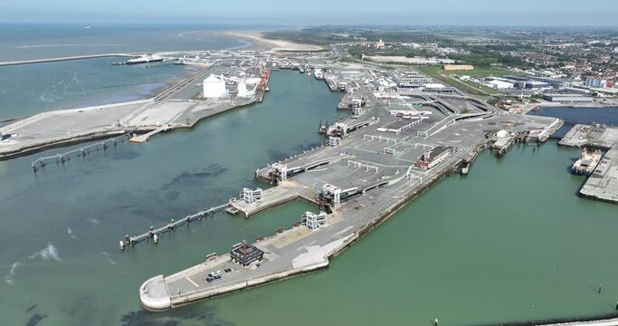 Aerial drone view of the Port of Calais. Ferry terminal, transportation industry, travel of sea, terminal, shipping over water.