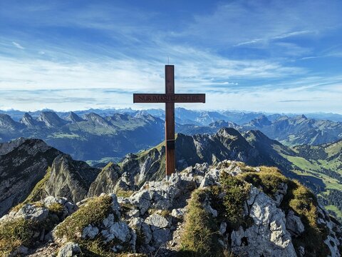 On the Silberplatten mountain in Appenzellerland Switzerland. Summit cross at the highest point. Hiking in the Alpstein. High quality photo