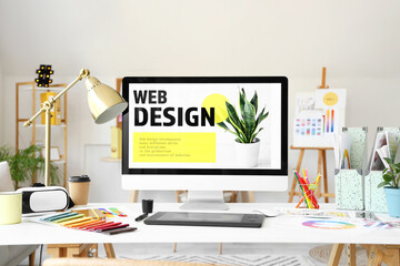 Interior designer's workplace with computer and graphic tablet in office