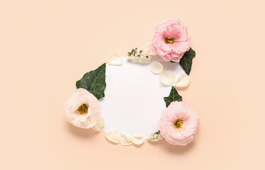 Frame made of blank paper sheet and beautiful flowers on pink background