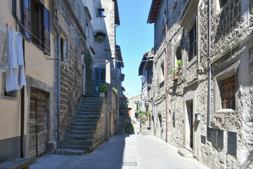 A street in the medieval neighborhood of Vitorchiano, a city in Lazio in the province of Viterbo, Italy. - obrazy, fototapety, plakaty