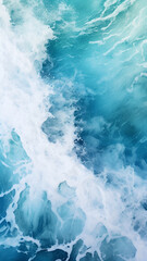 Fototapeta premium Spectacular aerial top view photo of ocean sea water white wave splashing in the deep sea, captured from a bird's - -eye perspective. The drone photo backdrop of the sea wave highlights its power 