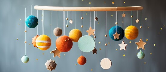 Eco friendly baby mobile above crib with space theme