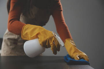 Office Cleaning Service. Janitor Spraying Desk. Workplace Hygiene