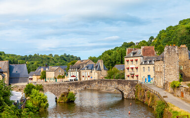 panoramic view of old stone bridge and historical medieval houses reflecting in La Rance river in Dinan town port - obrazy, fototapety, plakaty
