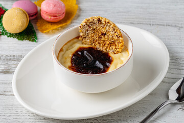 Traditional turkish dessert bakery rice pudding Turkish name Firin Sutlac in ceramic bowl