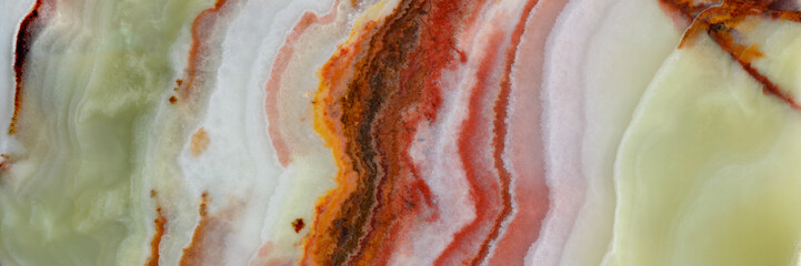 Onyx. Texture of semi-precious stone in green, brown, white colors. Variety of agate