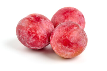 Red plums, isolated on white background.