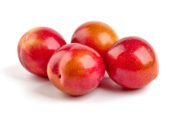 Red plums, isolated on white background.
